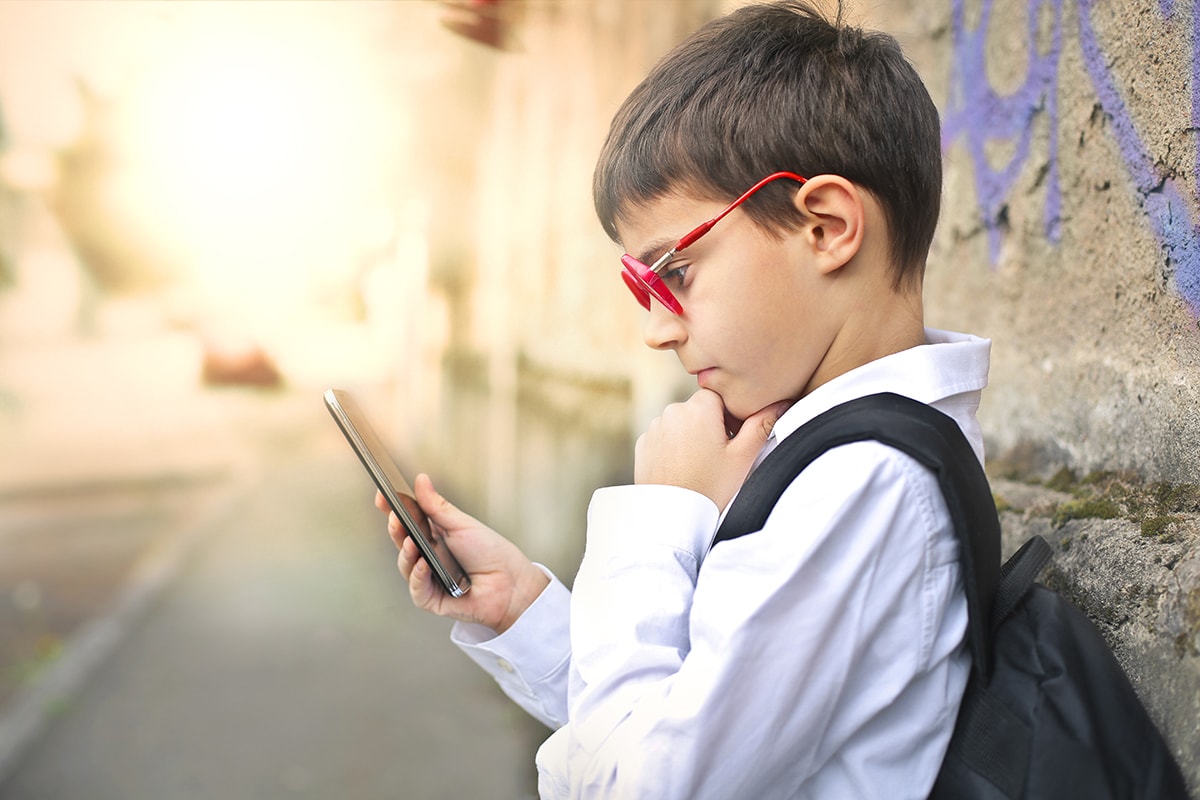 Boy looking at smart phone